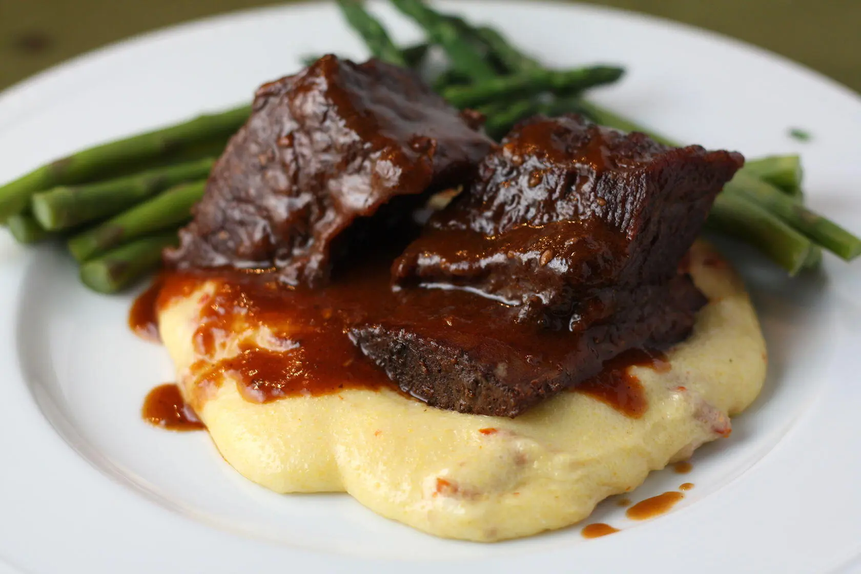 Sous Vide Ribs Topped with Hoisin Gastrique Over Root vegetable Puree.  Main Image